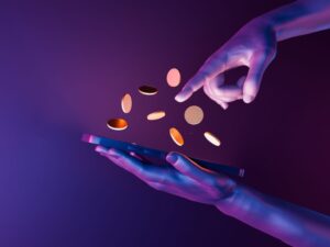 coins in the two between two human hand